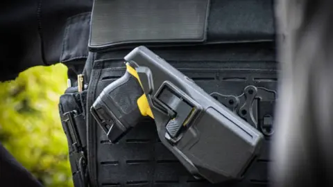 pistola taser GU